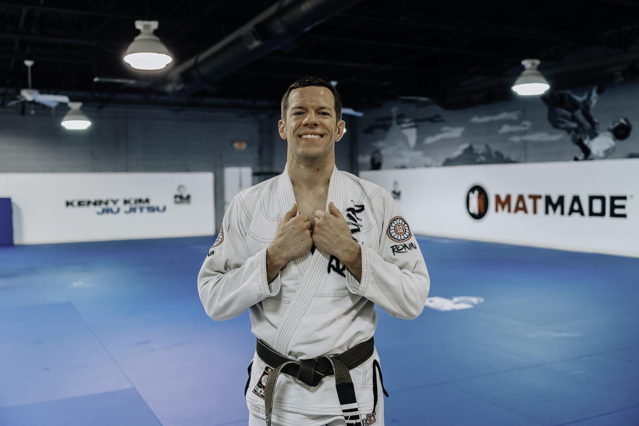 Charles Pinkham standing on the mats at Kenny Kim Brazilian Jiu Jitsu in Marietta GA